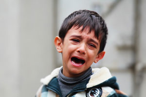 young boy crying