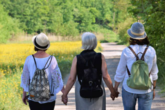 four women wearing white T-shirts