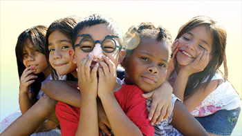 children in close group, one wearing a Groucho Marx mask