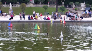 toy boats on a pond in a park